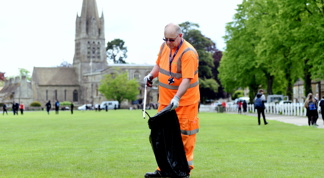 Waste operatives picking up litter on Church green, Witney